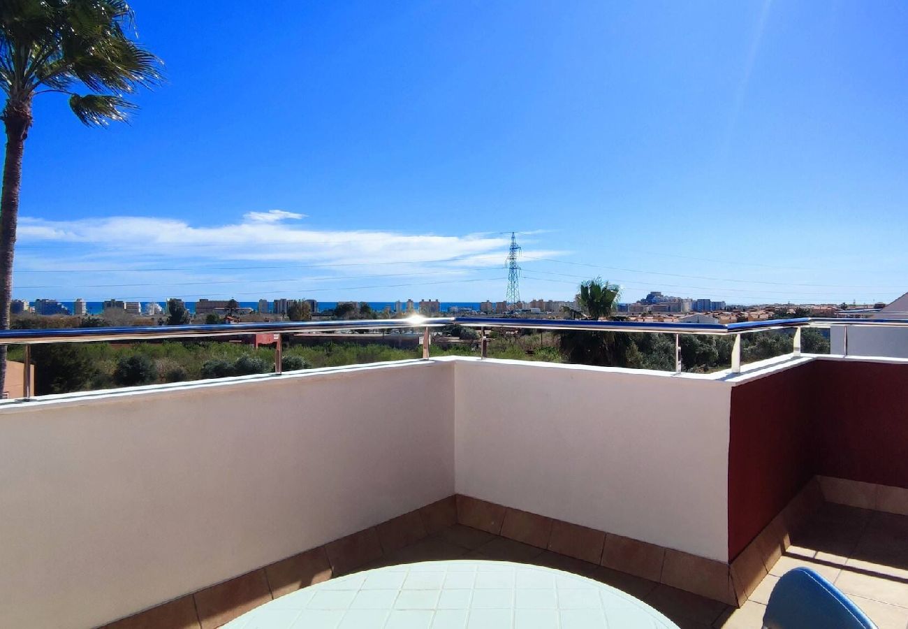 Maison mitoyenne à Peñiscola - Villa avec jardin commun et piscine 