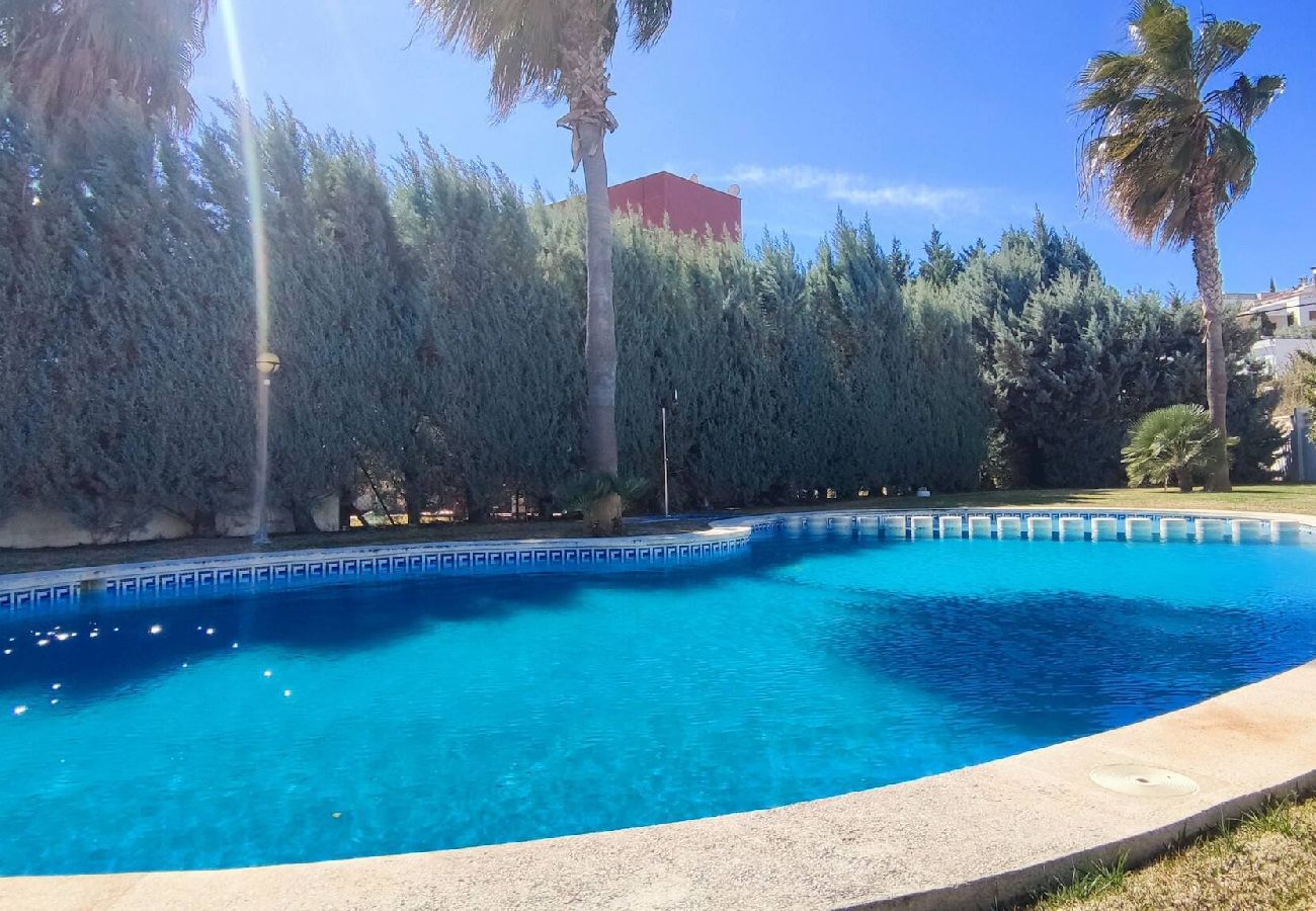 Maison mitoyenne à Peñiscola - Villa avec jardin commun et piscine 